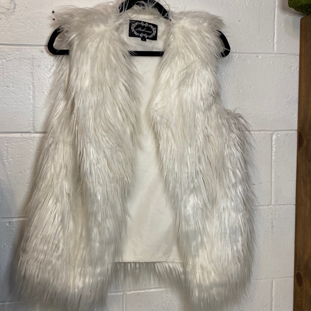 White fur vest